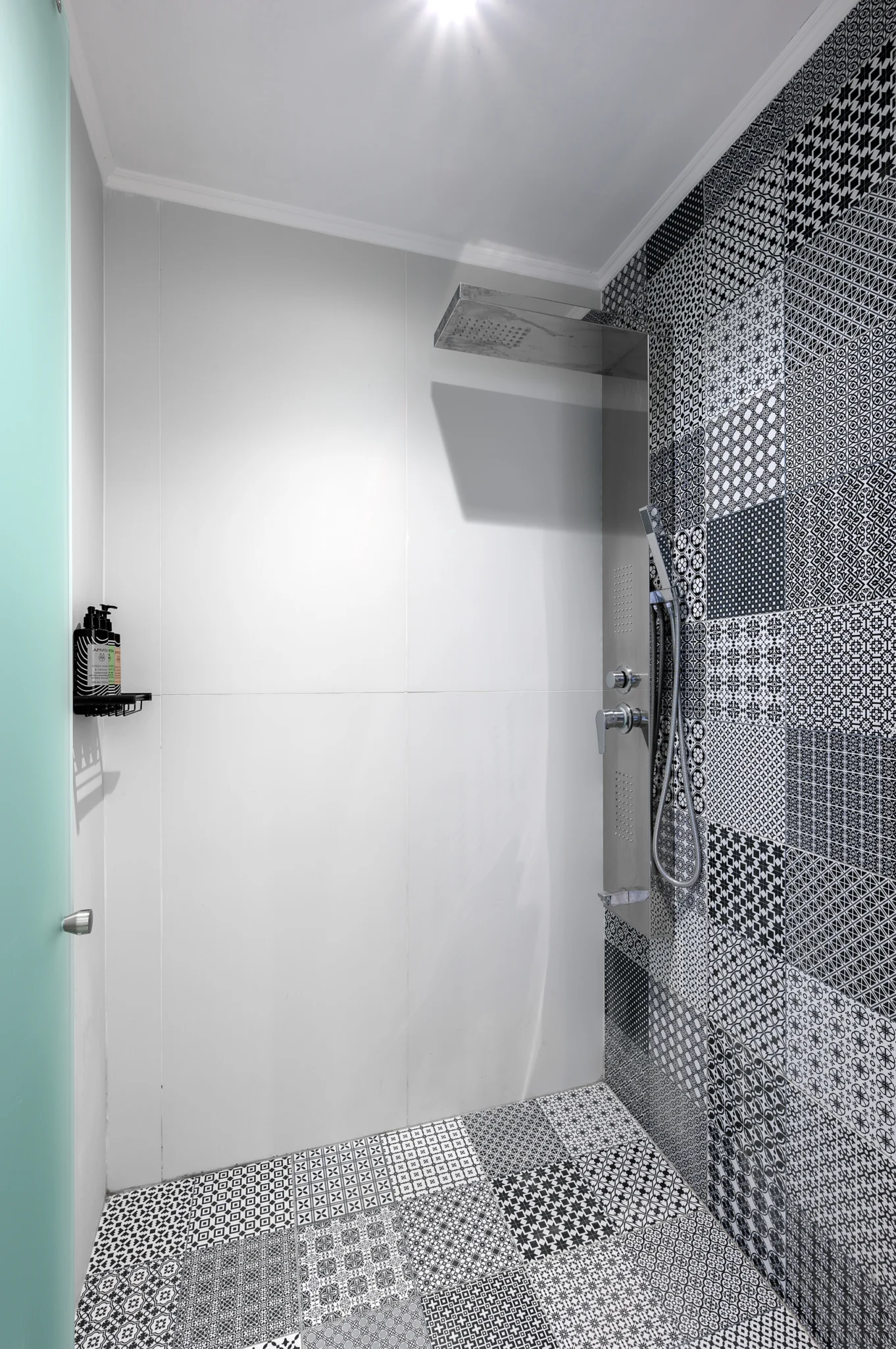 Shower interior with patterned wall and floor tiles at Blue Sky House, Pylos, Peloponnese, Greece.