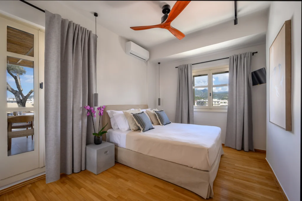 Penthouse Apartment in Kalamata – Residential Photography in Greece 5 Bedroom interior with window in a penthouse apartment in Kalamata, Greece