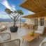 Rooftop terrace with outdoor seating and hot tub at a penthouse apartment in Kalamata, Greece