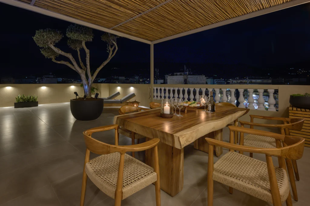 Penthouse Apartment in Kalamata – Residential Photography in Greece 12 Rooftop terrace dining at night at a penthouse apartment in Kalamata, Greece