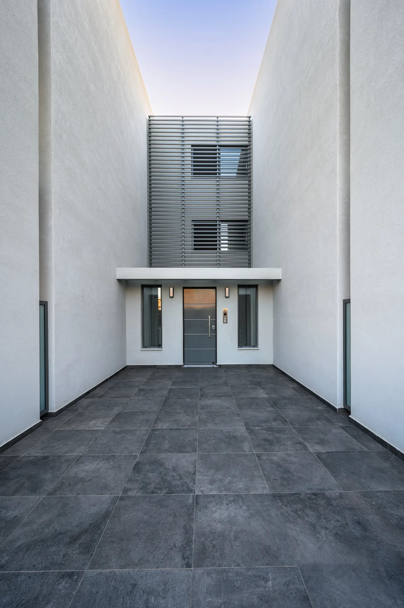 Tall central entrance courtyard between two residential buildings at Residential Complex in Athens, Athens, Attica, Greece.