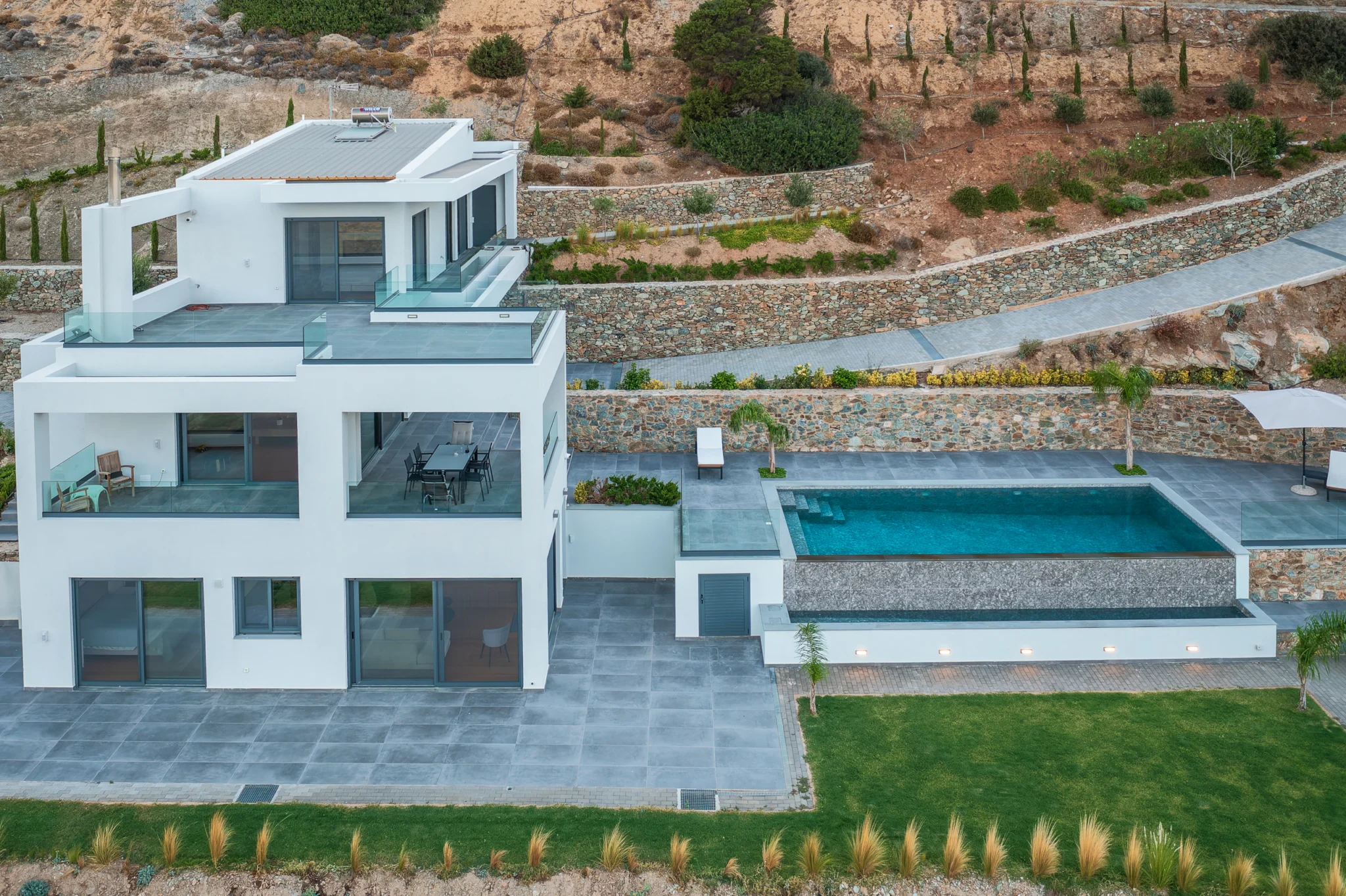 Aerial view of the white villa, swimming pool and terraced garden at Villa in Athens, Athens, Attica, Greece.