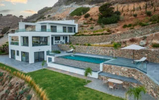 Aerial view of the villa and pool within terraced hillside grounds at Villa in Athens, Athens, Attica, Greece.