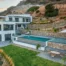 Aerial view of the villa and pool within terraced hillside grounds at Villa in Athens, Athens, Attica, Greece.