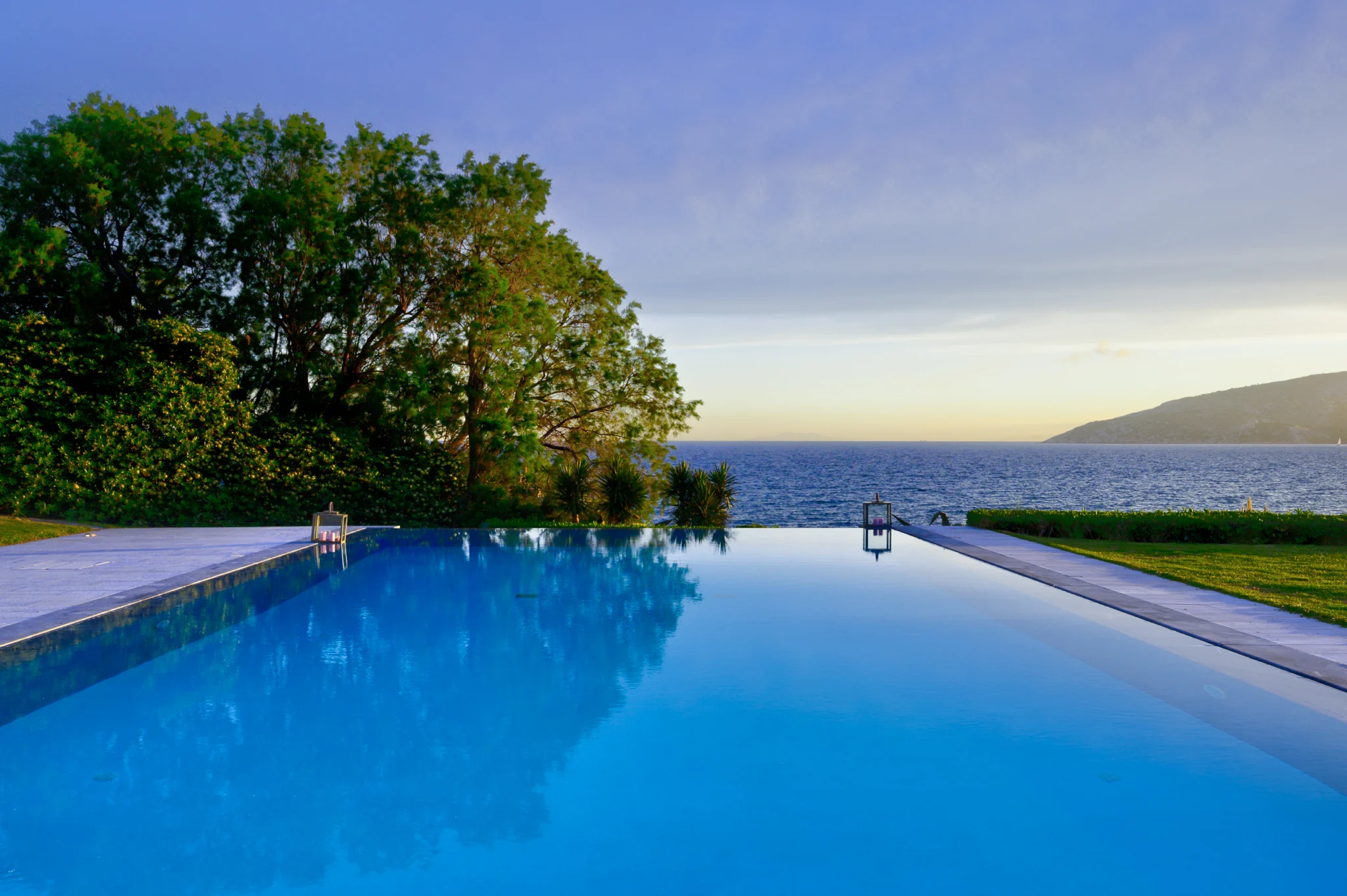 Swimming pool overlooking the sea in evening light at Villa Icarus.